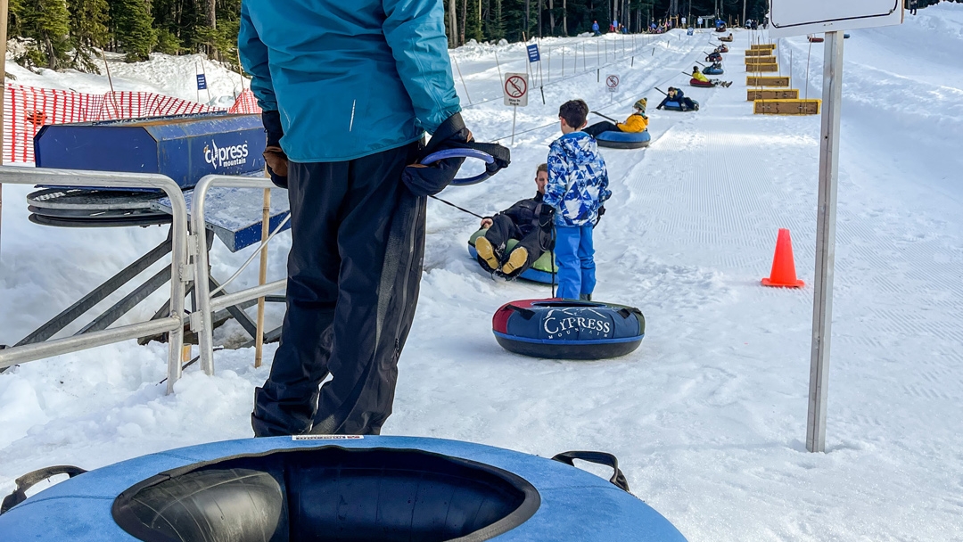 Boarding the tube tow at Gnarly's Tube Park at Cypress Mountain