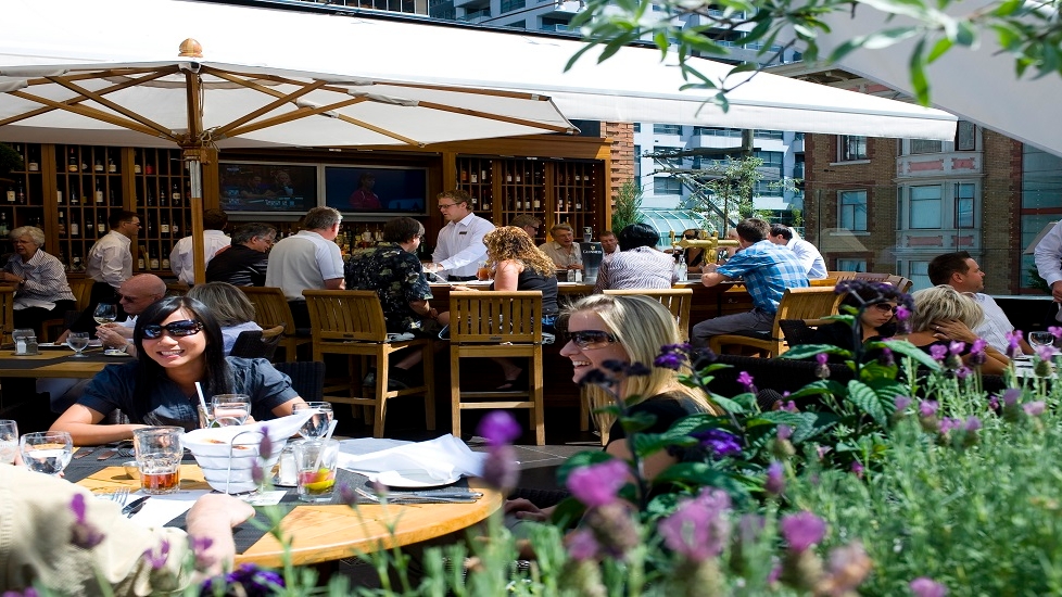 Diners enjoy the patio at Joe Fortes in Vancouver.